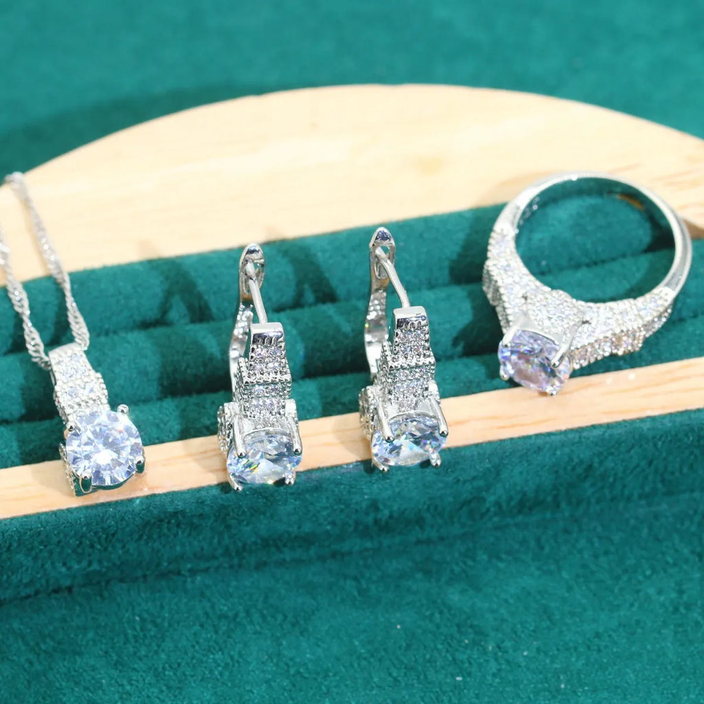 Bridal zircon jewellery four-piece set showing necklace, bracelet, earrings and ring in alloy with water wave chain