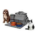 Grey dog travel backpack kit with removable divider and bonus training bag on a white background