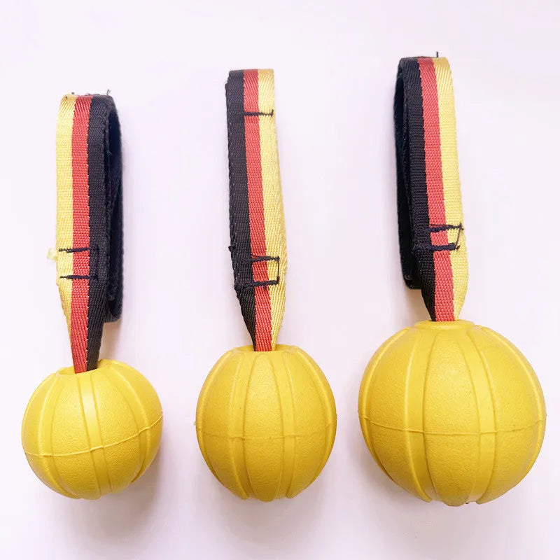 Yellow and camouflage coloured EVA foam floating tetherball dog toys in three different sizes on a blue background.