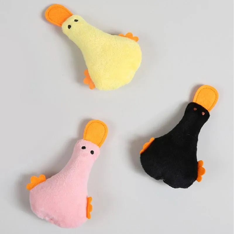 Plush duck dog and cat toy with catnip filling, squeaker, and rattle in blue, pink, yellow, or black