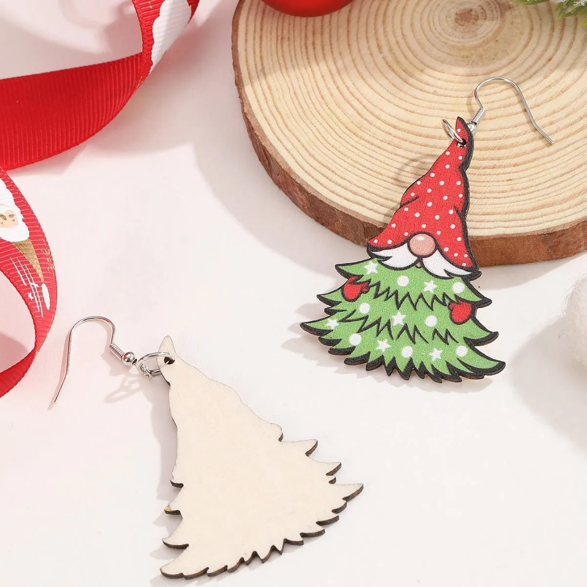 Wooden Christmas earrings with geometric shapes featuring printed Christmas tree and snowman Santa Claus designs