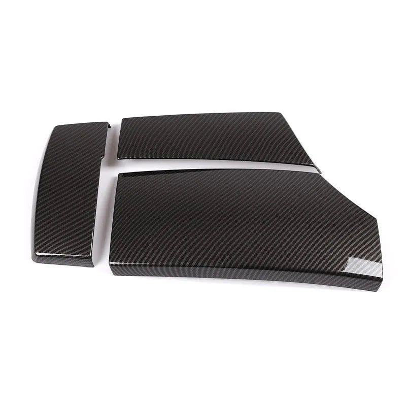 Three ABS carbon fibre pattern armrest box protective covers showing diagonal weave pattern and buckle installation system