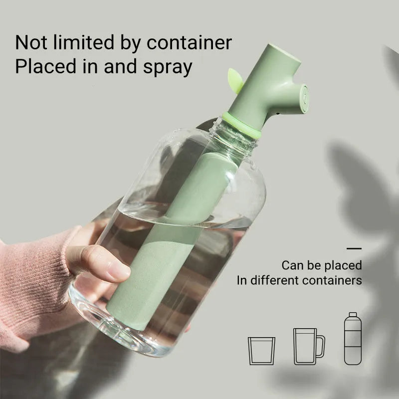 Transparent plastic USB portable humidifier with water tank showing mist output