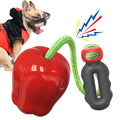 Green and red dog molar toys with hollow treat-dispensing ball design