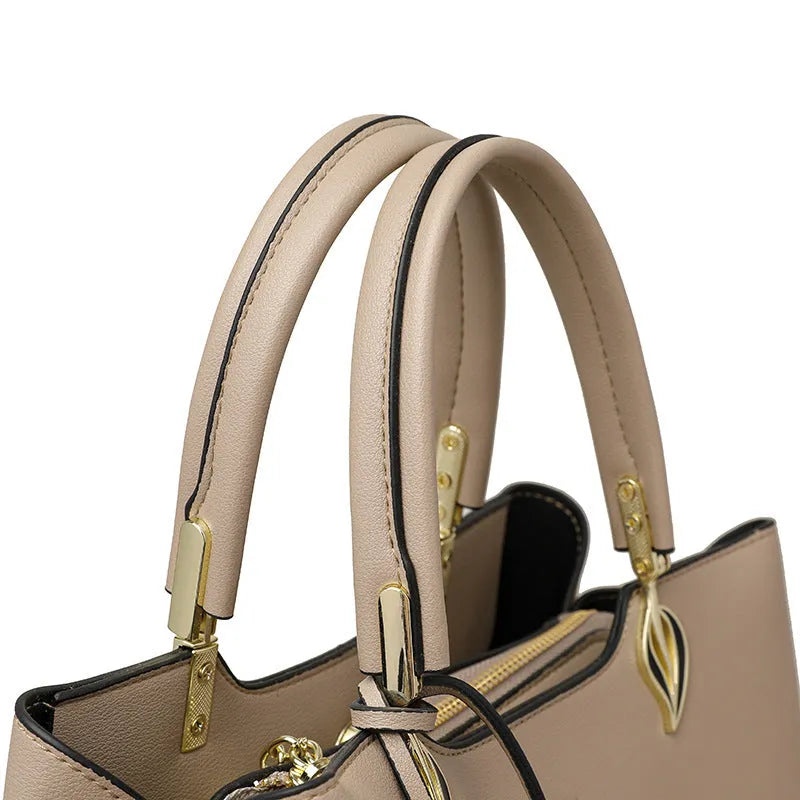 Women's black PU leather messenger bag with multi-layer interior compartments and a shoulder strap