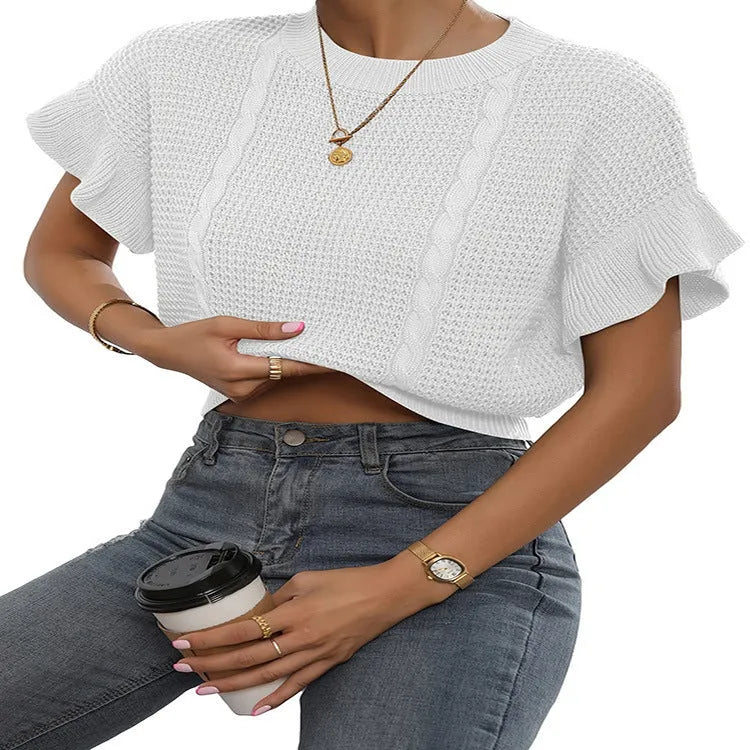 Loose fit knitted pullover sweater with twisted string pattern and ruffled short sleeves on a hanger.
