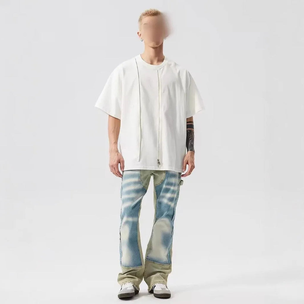 Retro jeans featuring yellow and blue patchwork splash-ink damaged design on non-stretch denim.