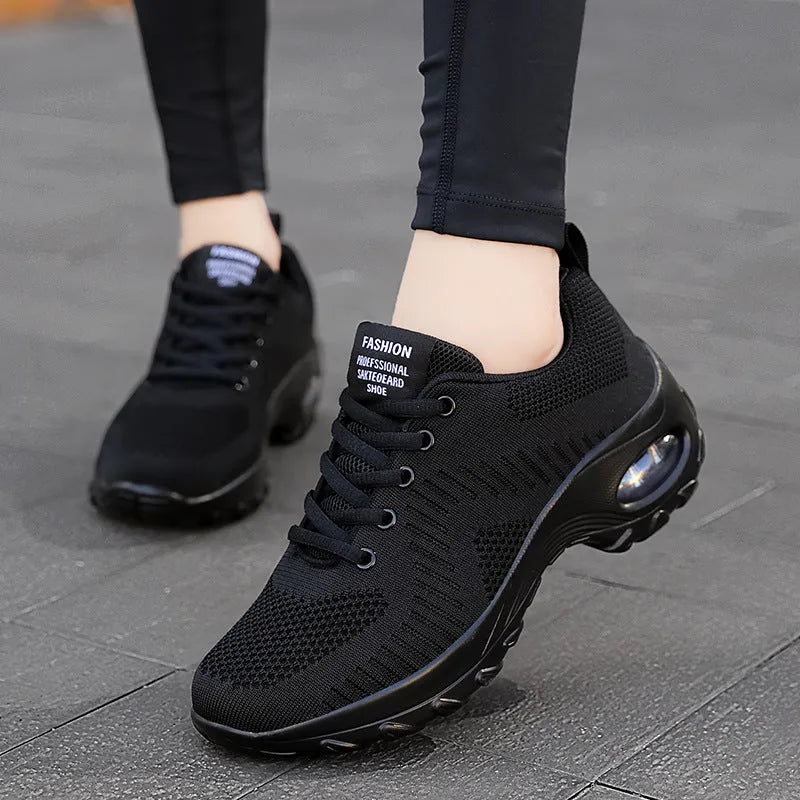 Women's red mesh sneakers with round toe and front lace-up design showing 3-5cm heel height