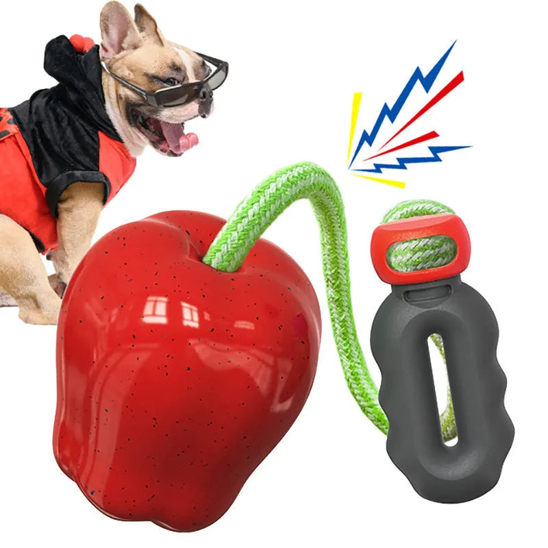 Green and red dog molar toys with hollow treat-dispensing ball design