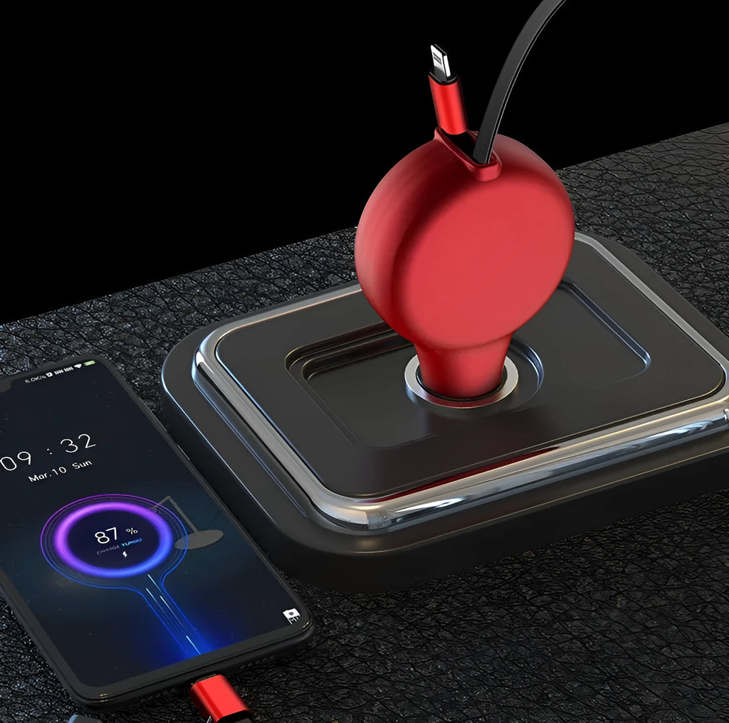 Black retractable dual-port car charger with extended cables next to smartphone