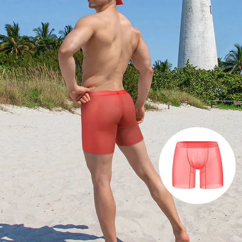 Men's solid colour boxers in ice silk nylon fabric showing low-waist design in orange, pink, and red options
