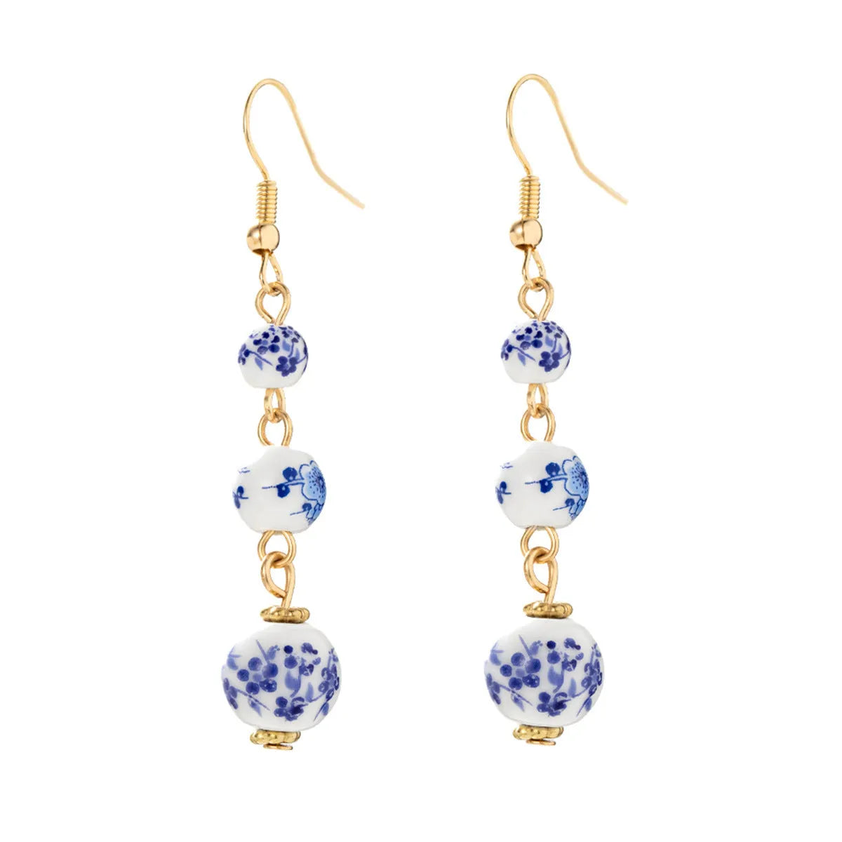 Long retro earrings with blue and white ceramic beads and geometric alloy parts.