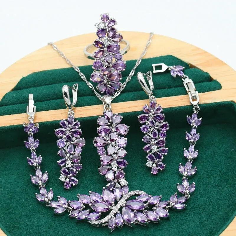 Retro jewellery set with plant pattern designs showing necklace, bracelet, earrings and ring pieces