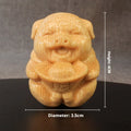 Solid bamboo carving ornament of a cute ingot pig, 4cm tall by 3.5cm diameter.