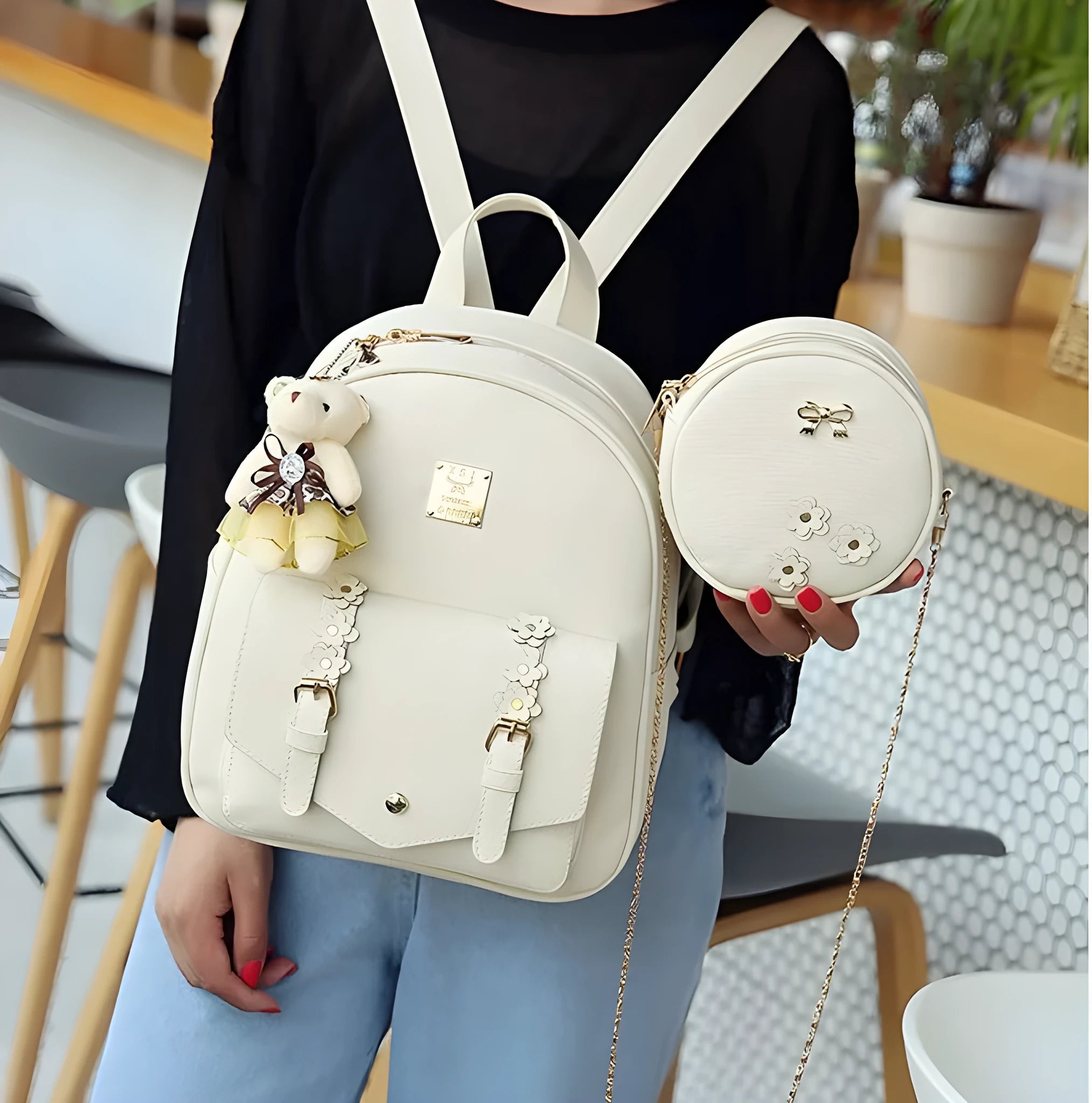 Women's three-piece PU leather backpack set showing backpack, crossbody shoulder bag, and card wallet in matching colour