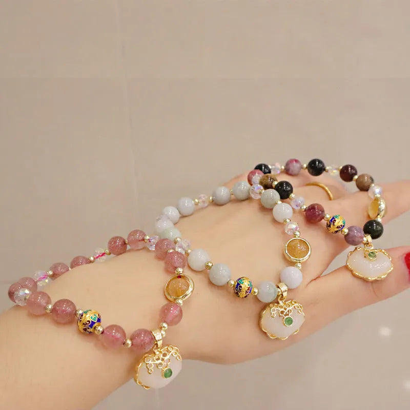 Geometric ethnic bracelet with strawberry quartz stones and metal decoration