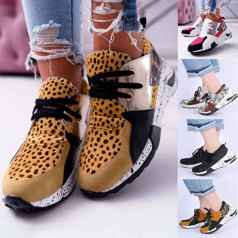 Women's suede flat sneakers with a wedge heel in leopard print, shown from the side.