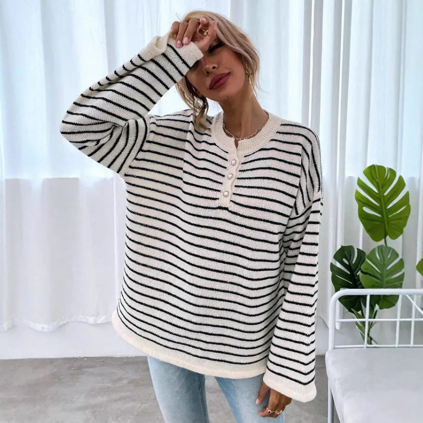 Women's black striped loose top with drop shoulders and button accents