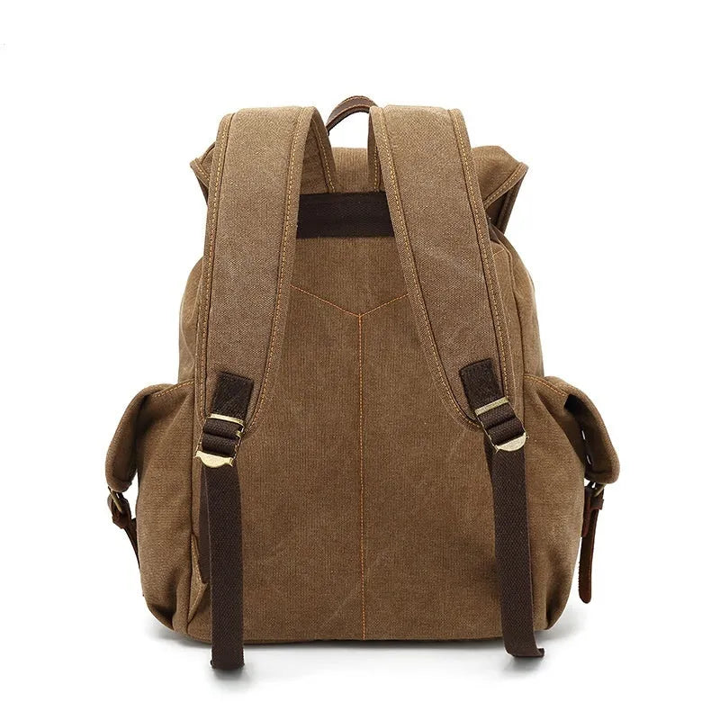 Retro canvas backpack in army green with antique bronze hardware showing dimensions and laptop compartment