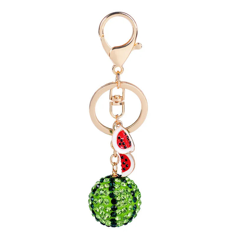 Green watermelon shaped zinc alloy keychain with diamond detailing measuring 12cm length