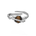 Women's adjustable silver open ring with Saturn design and white gold colour finish.