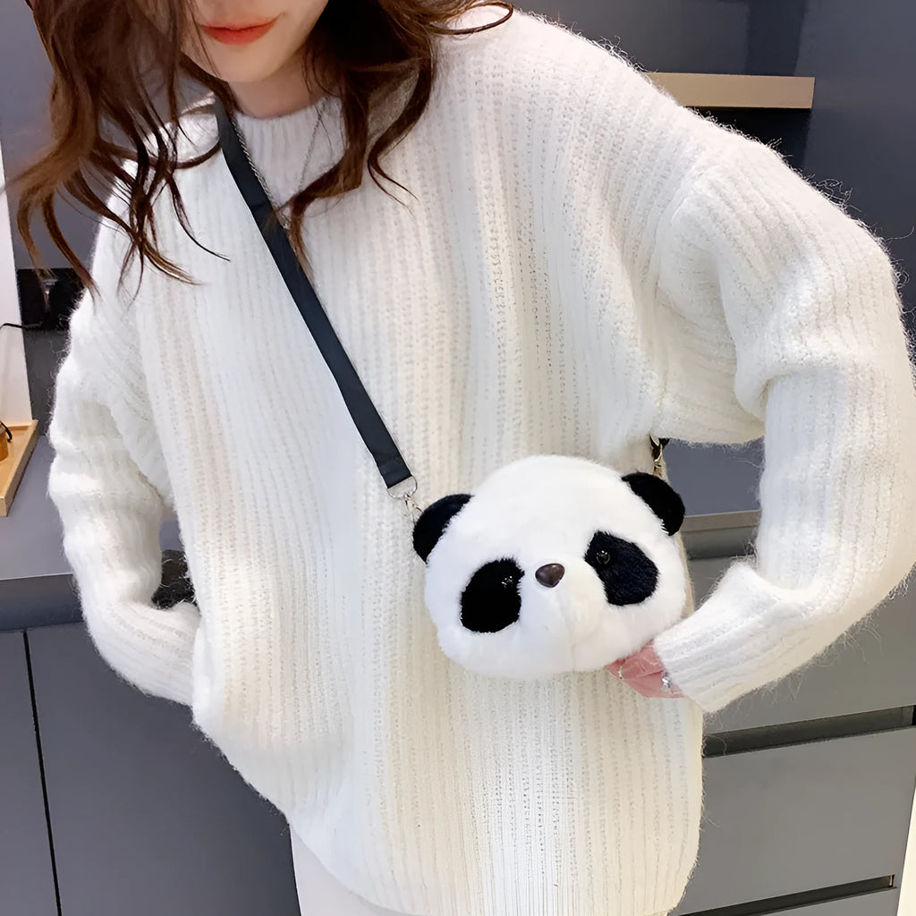 Soft plush cylindrical panda head crossbody bag showing front sandwich pocket.