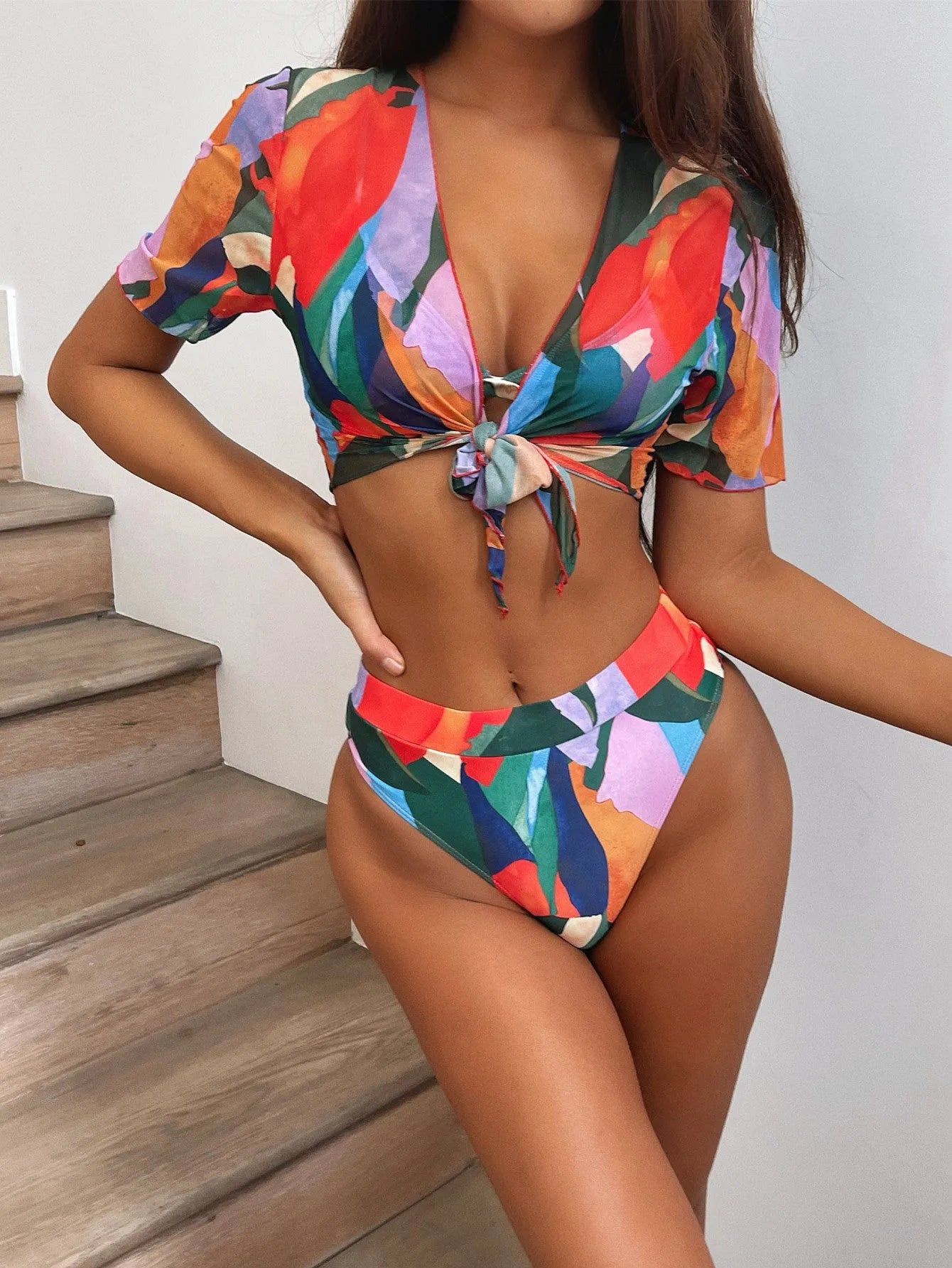 Red women's split swimsuit, a nylon bikini in a casual surfing style.