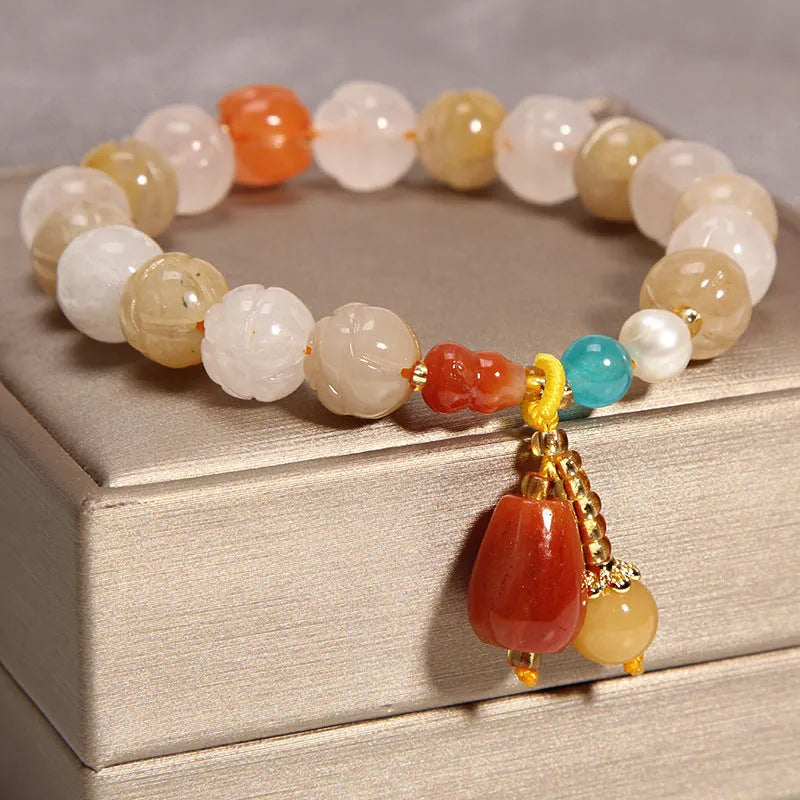 Women's yellow agate and crystal adjustable wrap bracelet on gold silk thread in khaki.