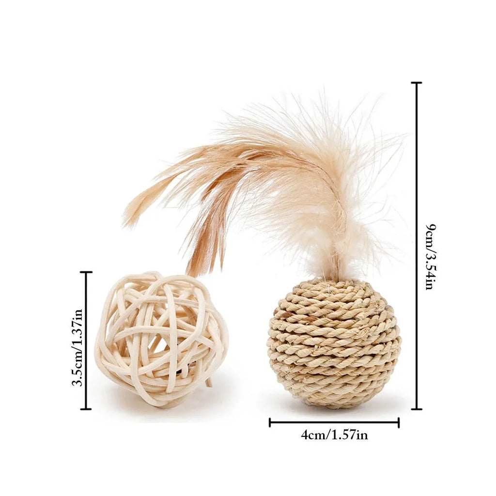 Set of two cat toys: a hollow rattan ball and a faux feather ball with bell, on a plain background.