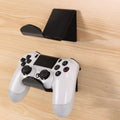 Universal plastic wall mount bracket holding a game controller, shown in black, white, and transparent colour options.