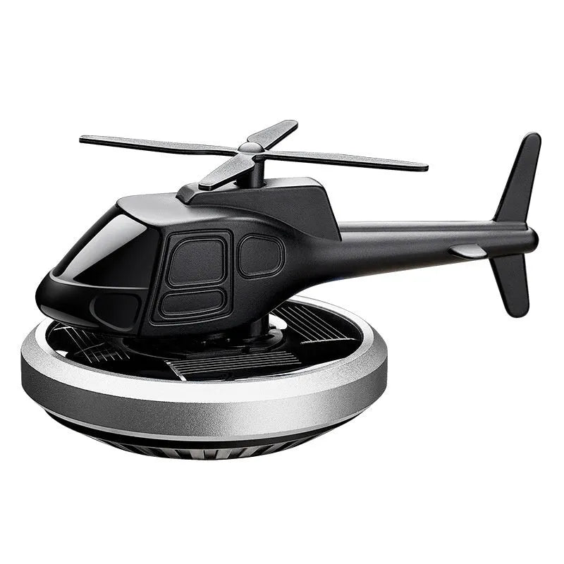 Silver metal solar helicopter car perfume ornament with rotating blades on dashboard