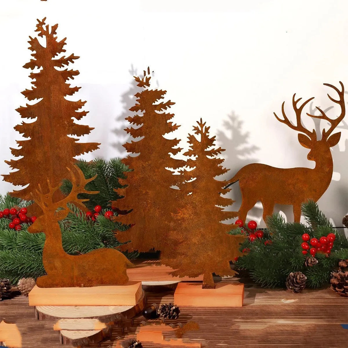 Three iron Christmas tree ornaments with elk designs in rustic finish