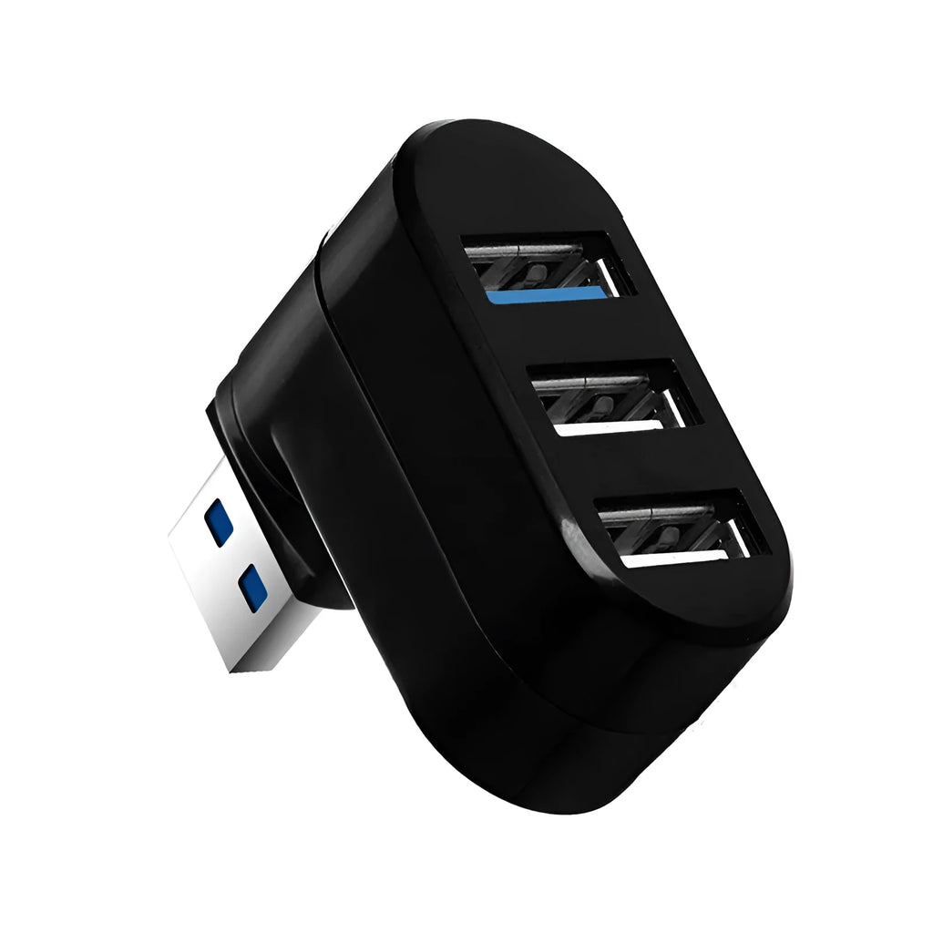 Black or white 4-port USB hub on a desktop next to a laptop and various peripherals.