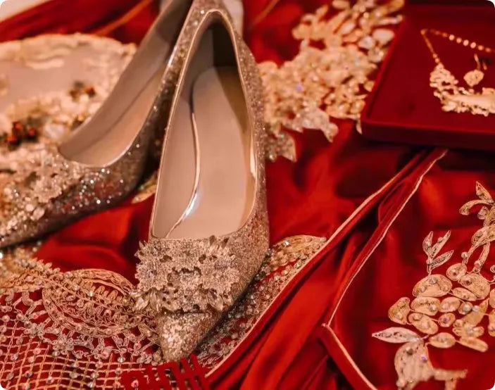 Champagne coloured pointed toe wedding heels with rhinestone floral detail on a fine heel.