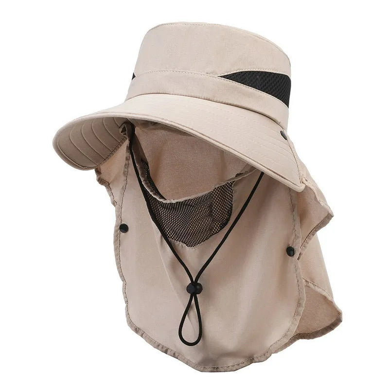 Man wearing a grey adjustable wide-brim fisherman hat made of polyester for sun protection.