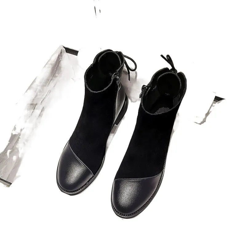 Women's black Martin boots with side zipper, round toe, and decorative bow detail