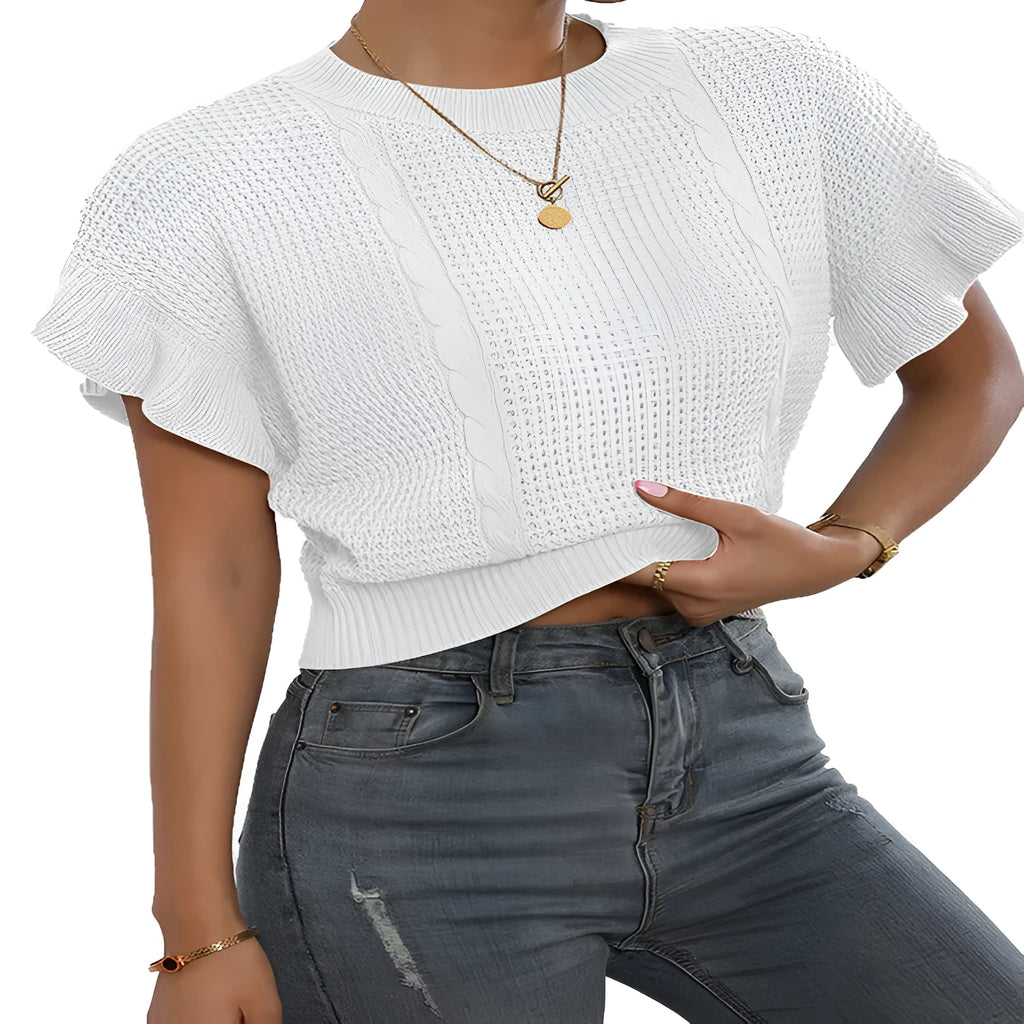 Loose fit knitted pullover sweater with twisted string pattern and ruffled short sleeves on a hanger.