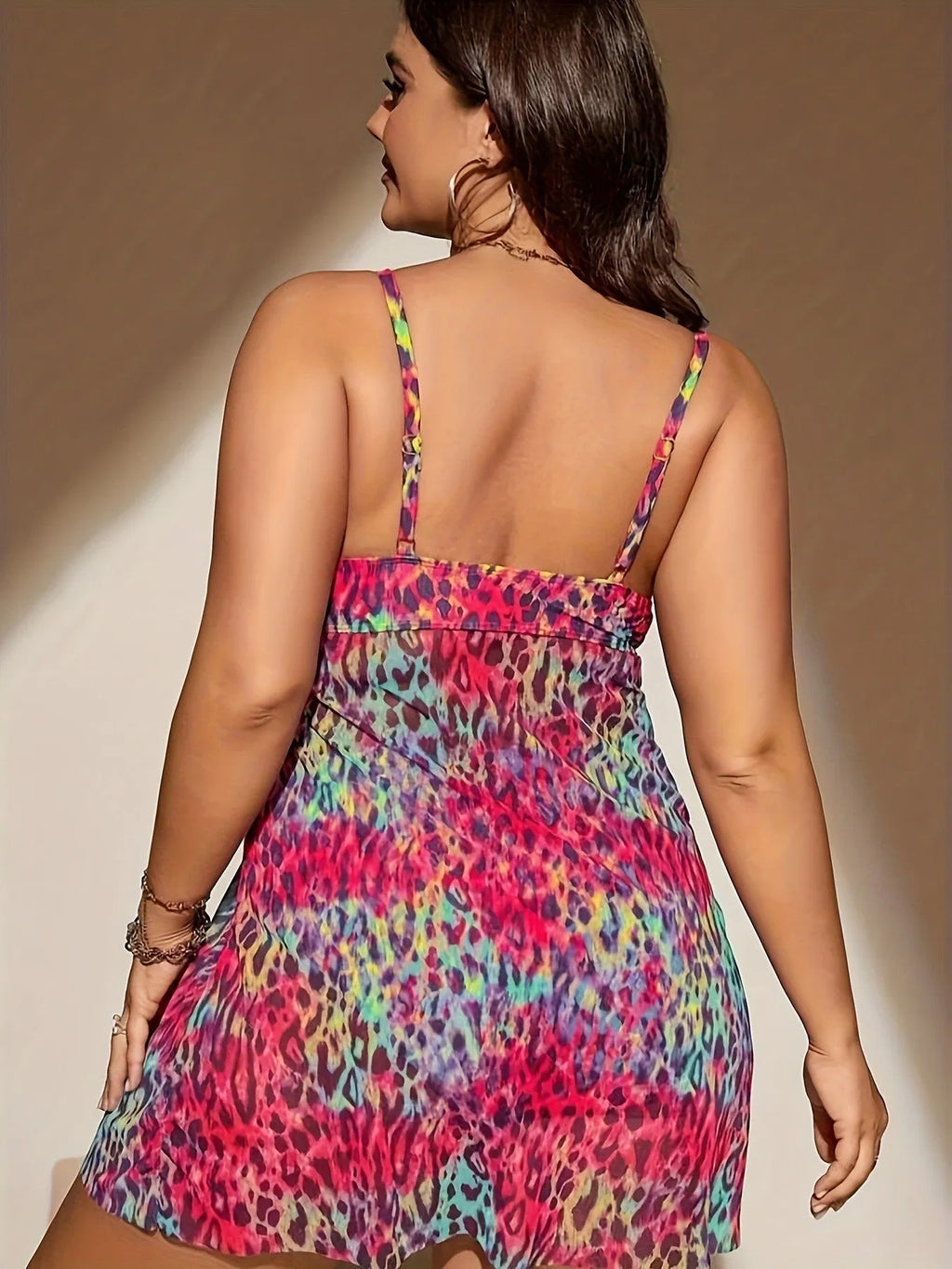 Plus size women's split skirt bikini set in blue, showing sleeveless top and shorts.
