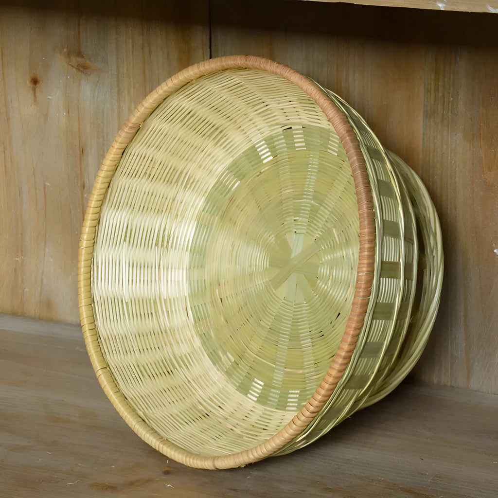 Handmade woven bamboo storage basket in natural colour showing three size variations