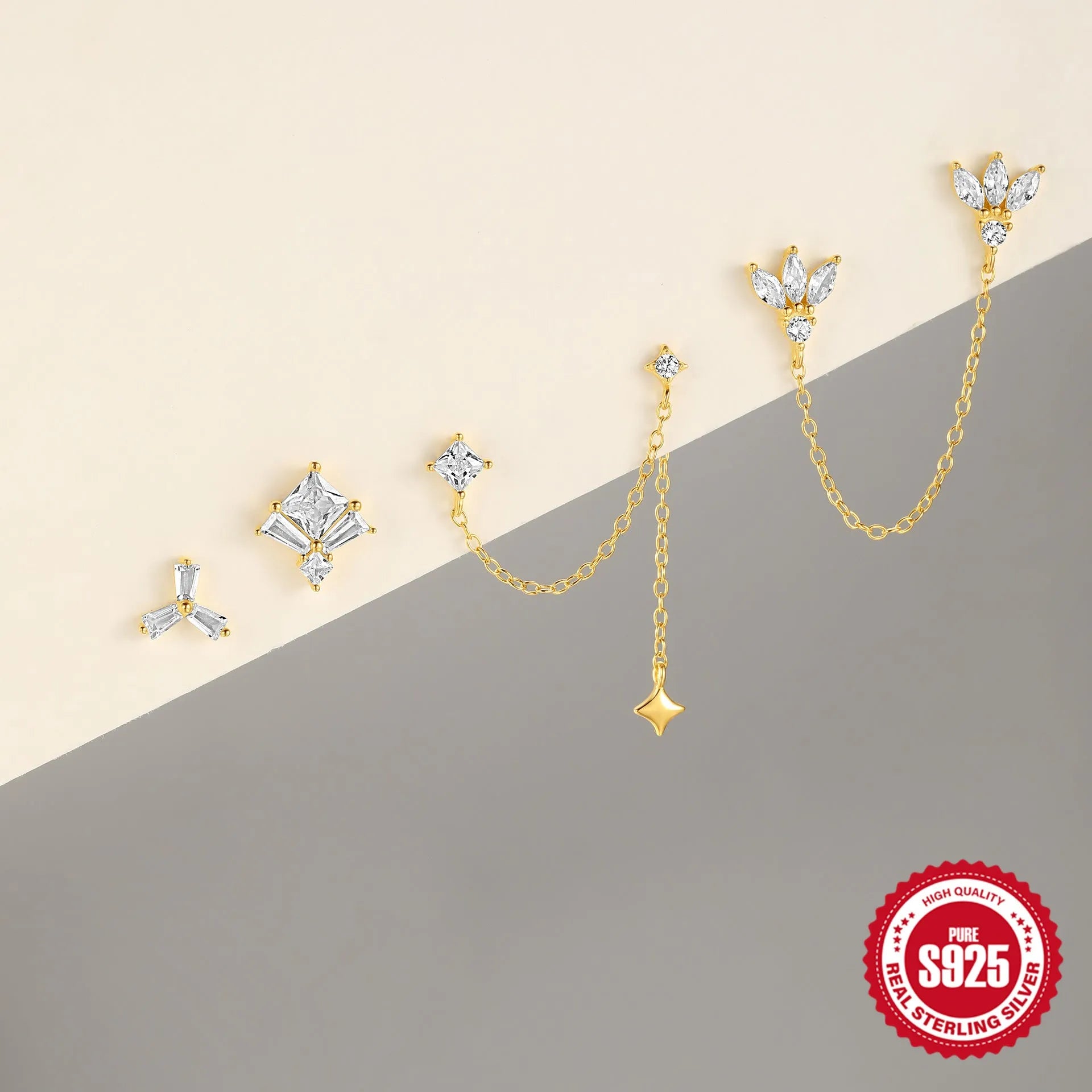 A pair of golden S925 sterling silver stud earrings with zircon inlay, designed for double ear piercings.