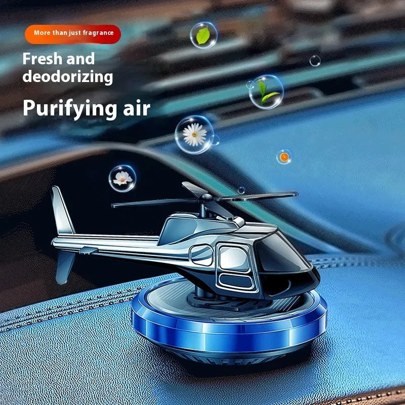 Silver metal solar helicopter car perfume ornament with rotating blades on dashboard