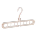Plastic clothes hanger with rotating hook in pink and green colours on a rail.