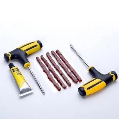 8-piece vacuum tyre repair tool set with probe, pin, glue bottle, and rubber strips on black background.
