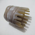White buffalo horn comb with wide teeth and pointed tips for scalp massage and hair care