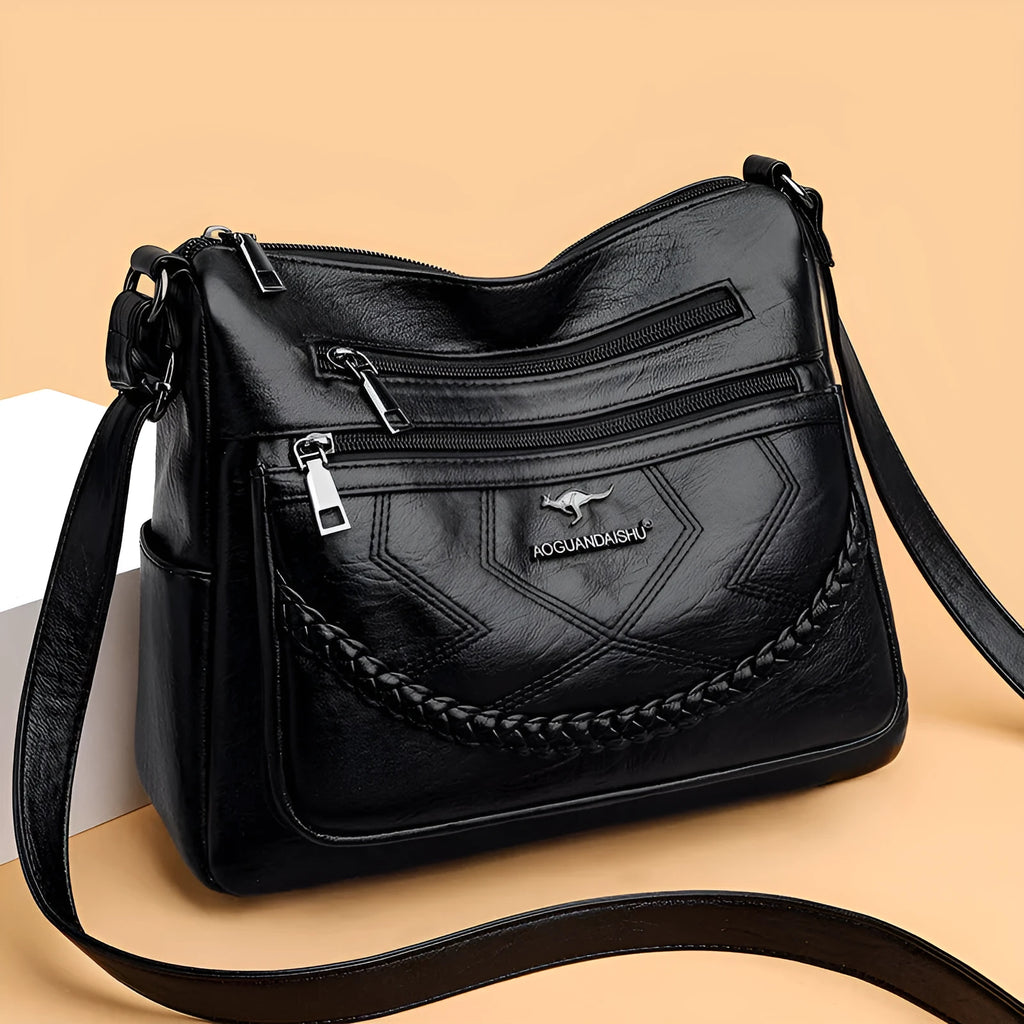 Soft PU leather women's crossbody shoulder bag in horizontal square shape with internal zipper compartments