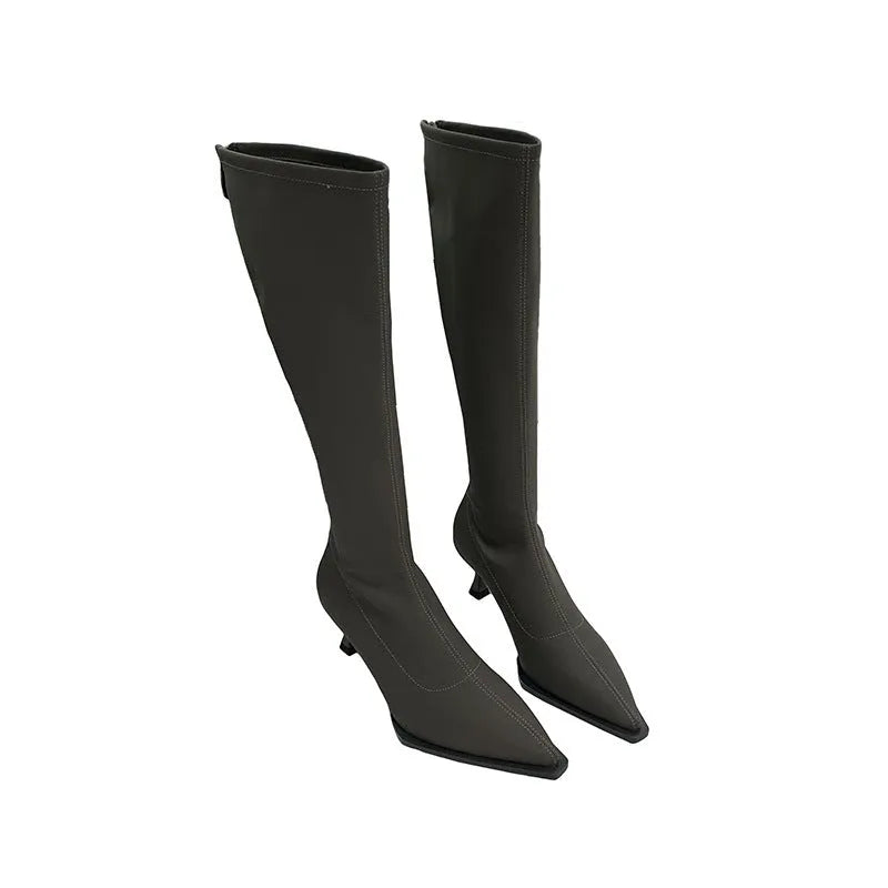 Women's black pointed toe ankle boots with a stiletto heel and a back zipper fastening.