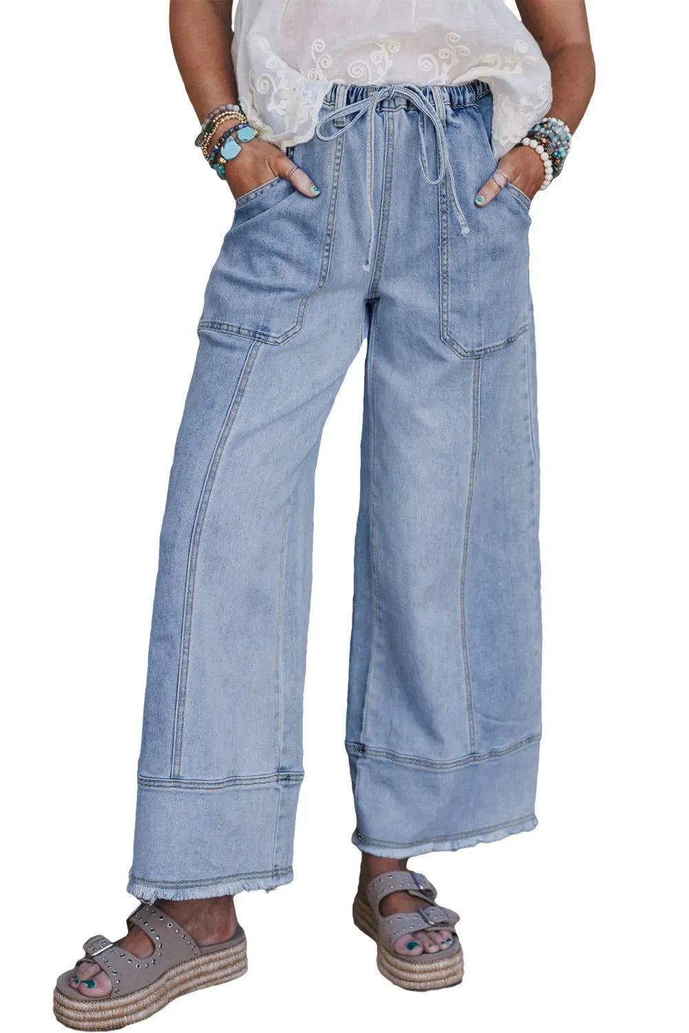 Beau blue wide leg denim pants with elastic drawstring waist and raw hem finish laid flat