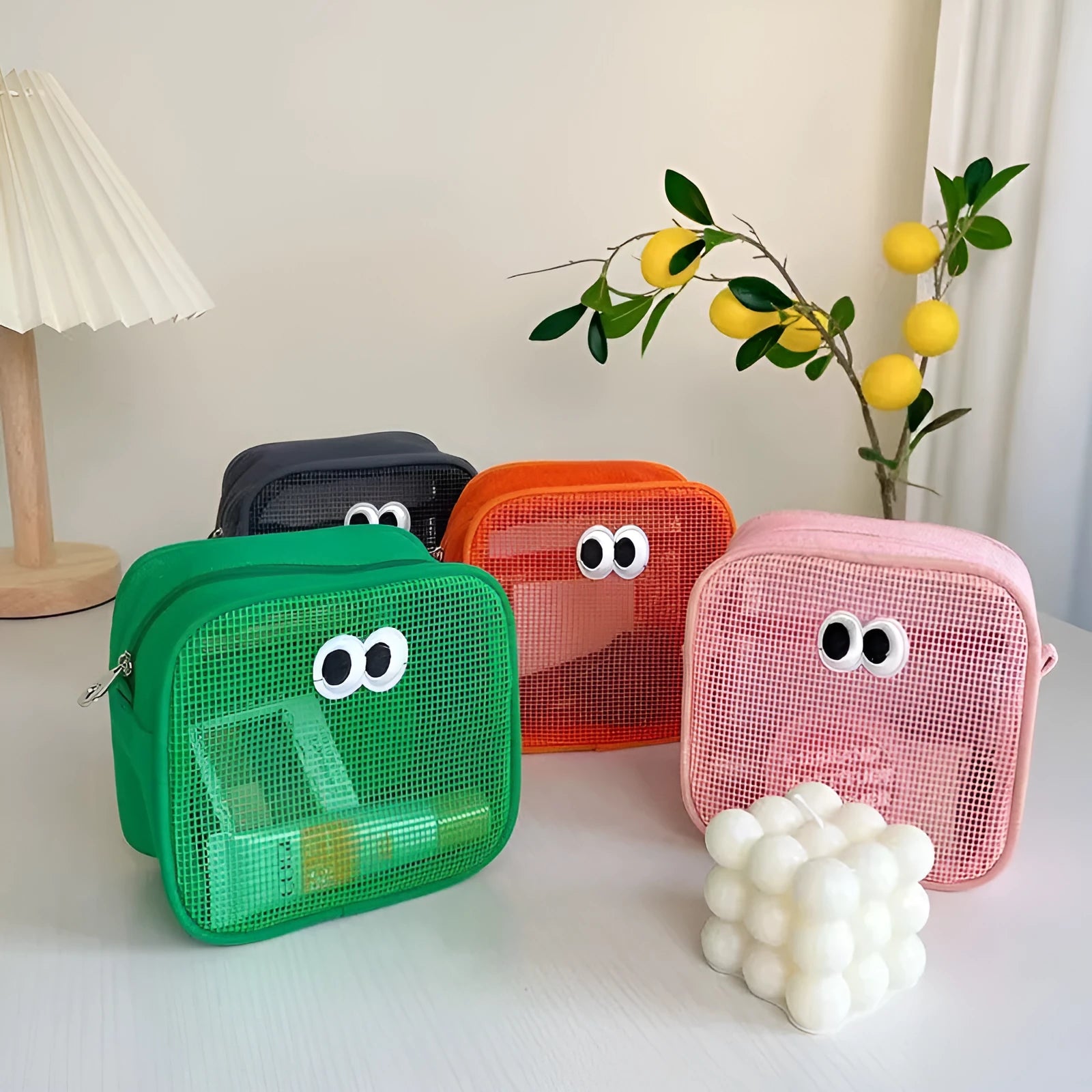 Stereo large capacity mesh makeup wash bag in cube shape, polyester, with zip closure, on a table