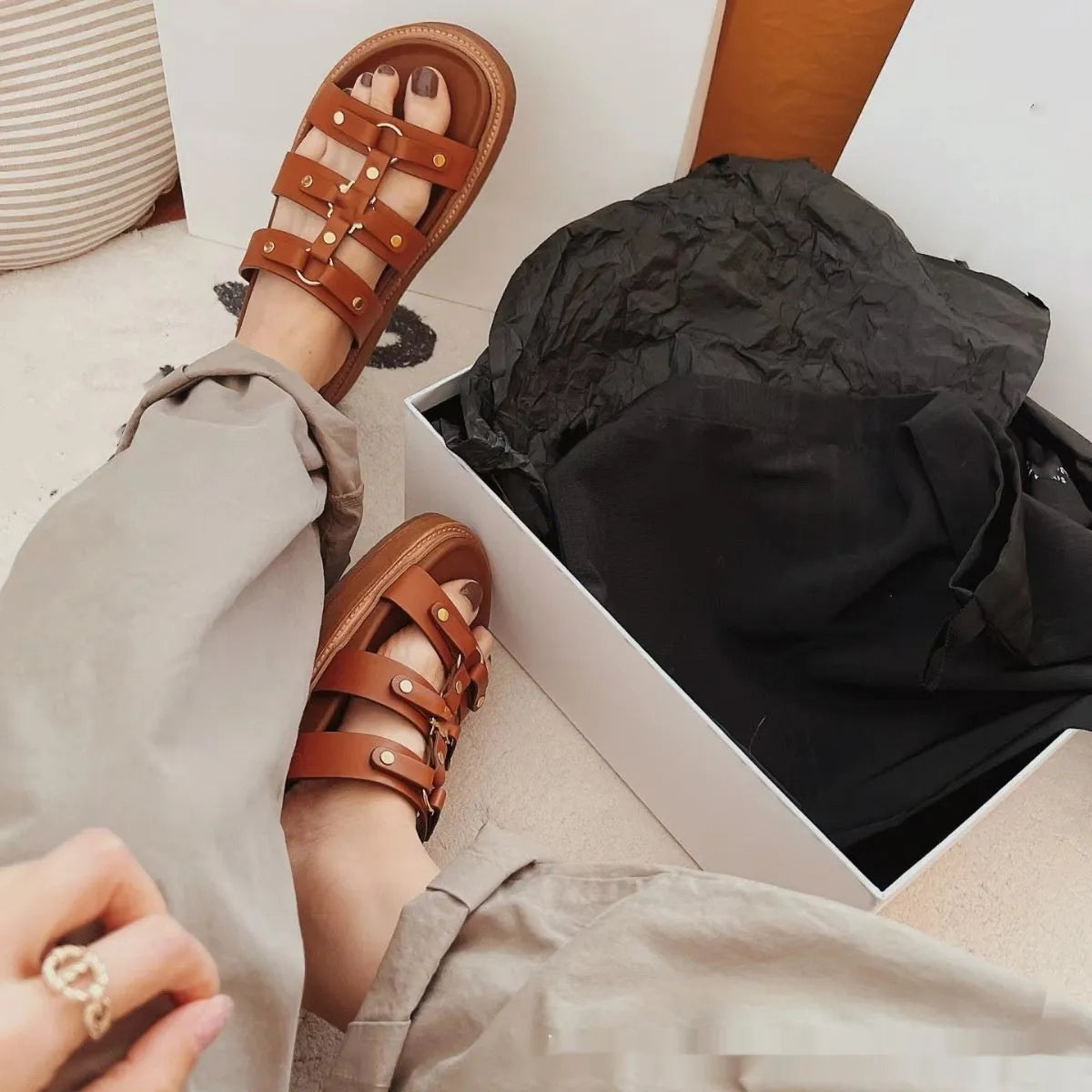 Women's Roman sandal slippers in patent leather sheepskin, shown in black, brown, and white.