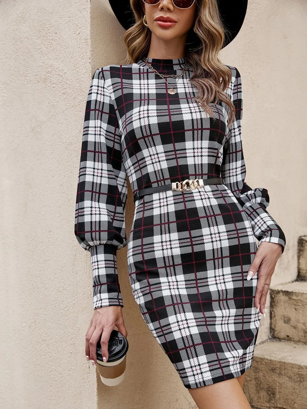 Black tight dress with lantern sleeves and leather stitching detail in midi length